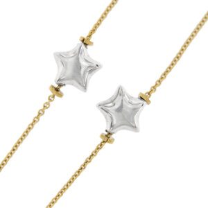 zoom dettaglio stelline di collana in due ori con stelle