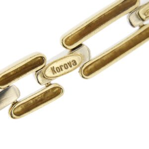 zoom dettaglio brand Korova su catena di collier in oro con rubino e diamanti