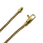 dettaglio zoom di chiusura a moschettone su bracciale oro giallo maglia pallini